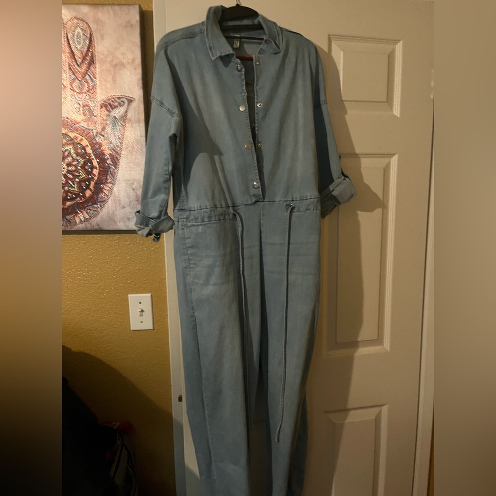 Sexy denim jumpsuit with silver chain back accents